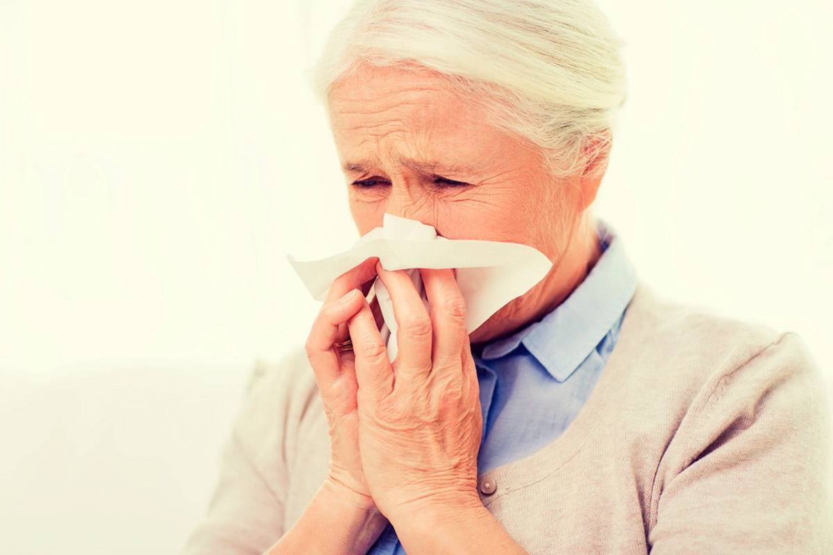 Senior woman with cold or flu