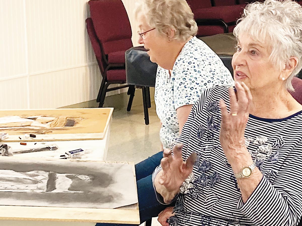 Photo of two senior women in an art class