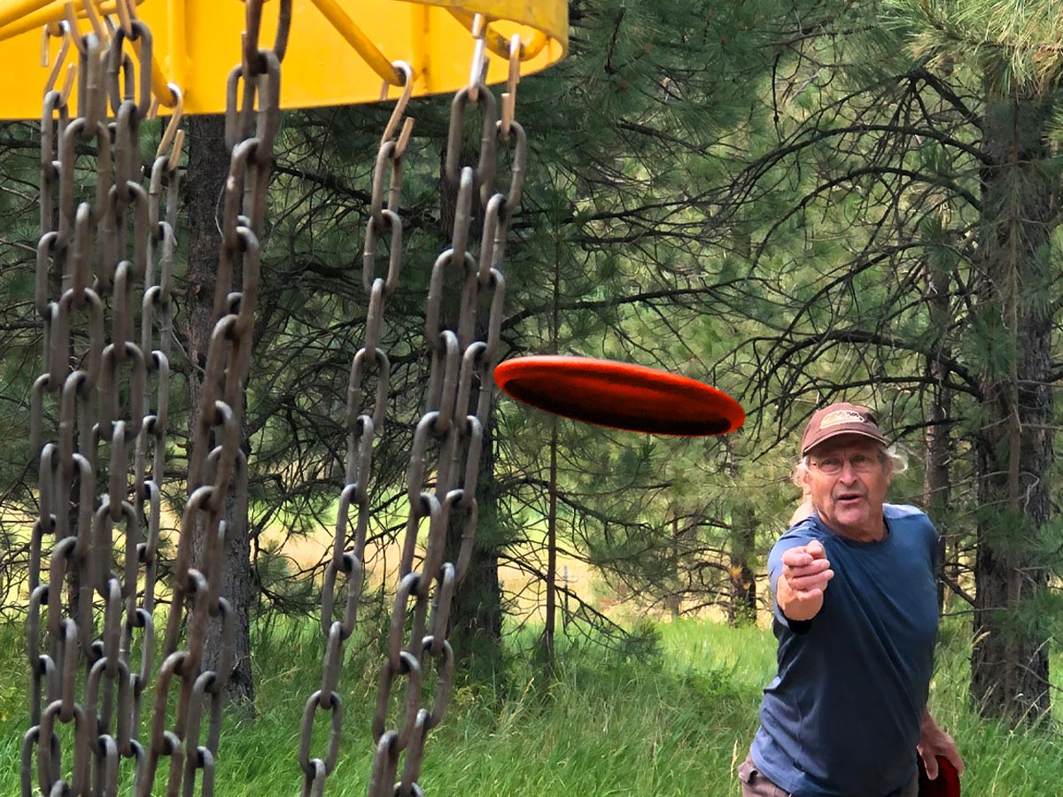 photo of senior man playing disc golf