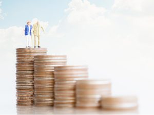 Plan for Inflation, the Terrible Retirement Partner Illustration of senior couple walking down stairs built from coins