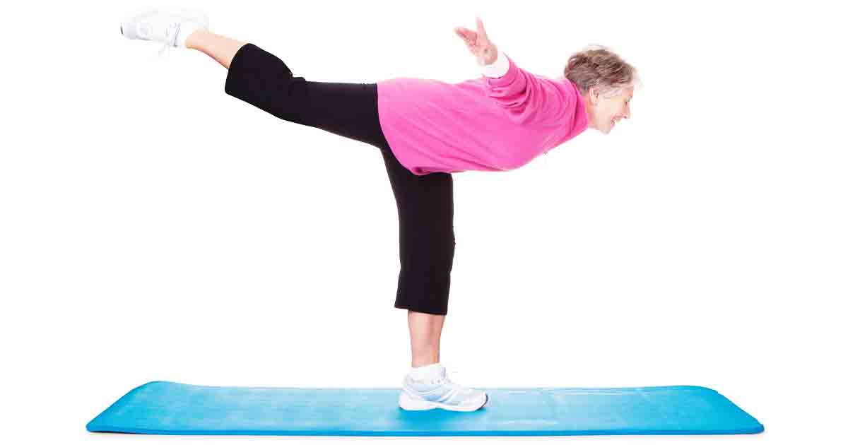 Photo of a senior woman practicing her balance, representing the importance of staying balanced as we age.