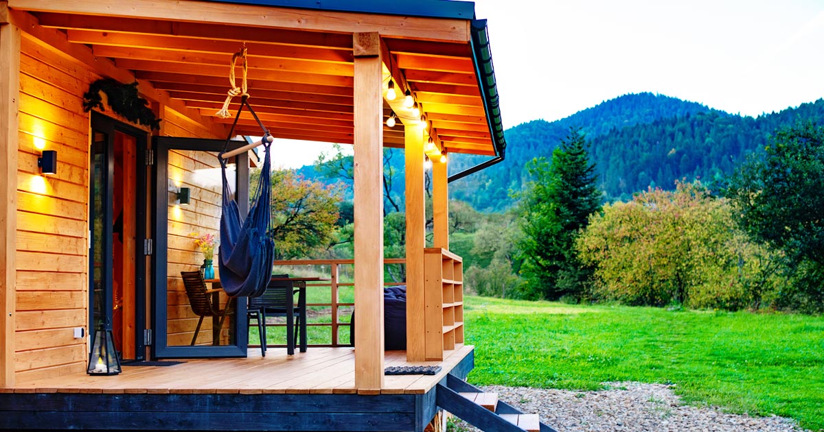 Photo of a chalet with a mountain backdrop, typical of flexcation getaways