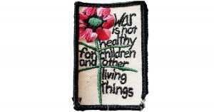 Letter from the Publisher: Keep the Peace Photo of a patch that reads War is not healthy for children and other living things
