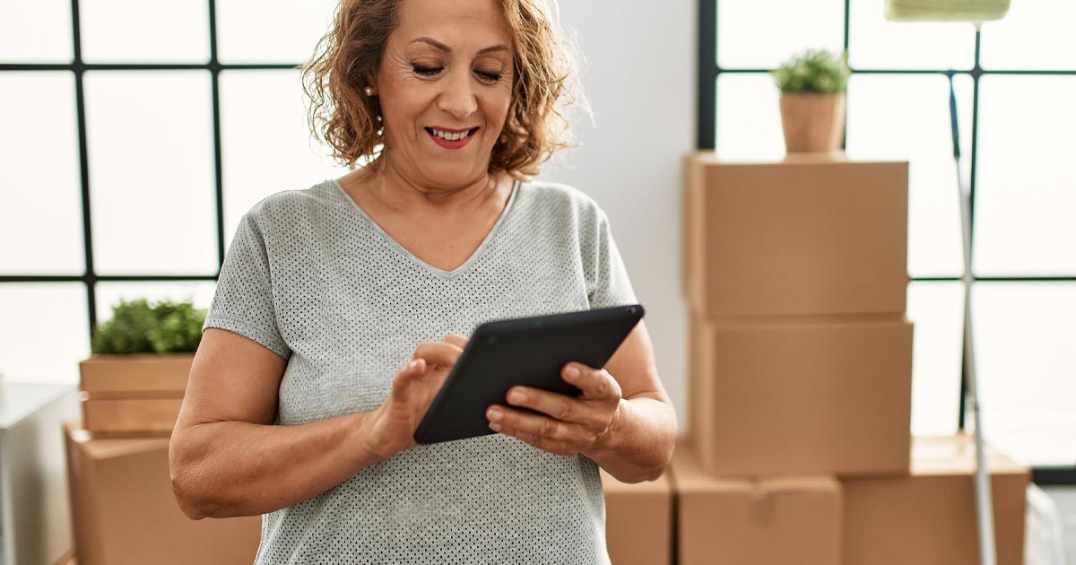 Woman organizing moving boxes