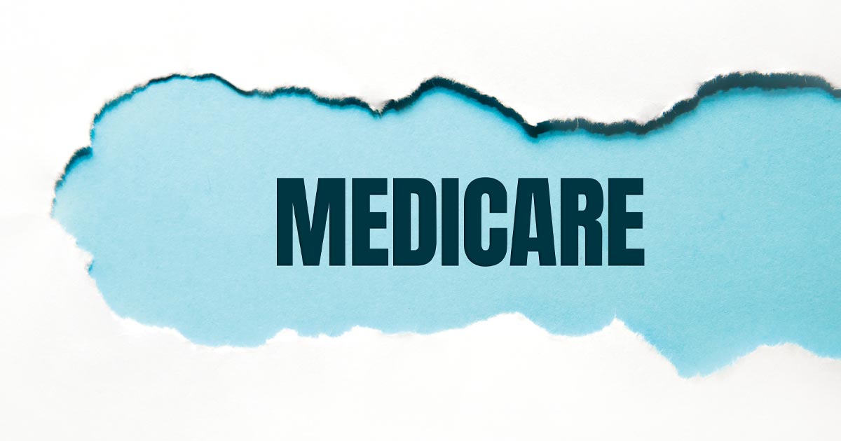 black "medicare" text on blue background revealed from a tear in white paper.