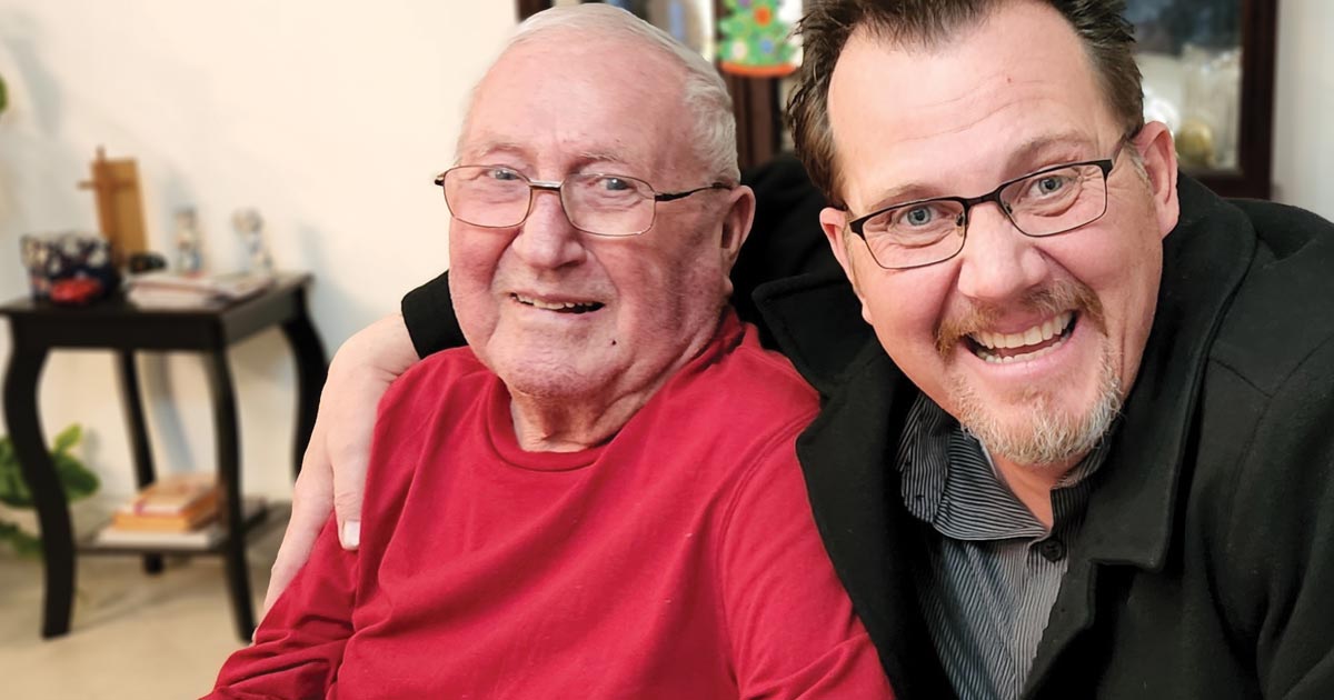 Pastor Dan Hendricks regularly visits Dallas Stoller at his home in Paul, Idaho. Photo by Nancy Kunau.