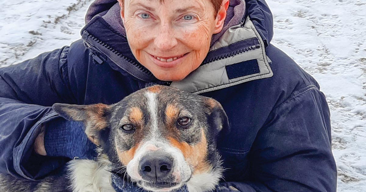 Susan Wilson with her sled dog: Wilson enjoys dog sledding