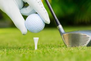Golf ball, club and hand.